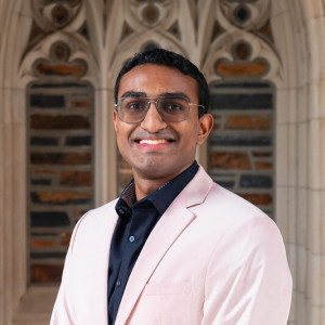 Photo of Joel Valan in front of Duke chapel hallway