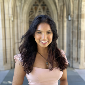 Photo of Mahi Patel in front of Duke chapel hallway