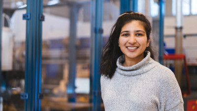 Sonia Bansal is in front of a blue machine