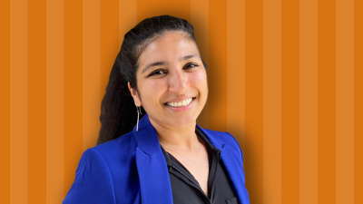 Sonia Bansal is against an orange background